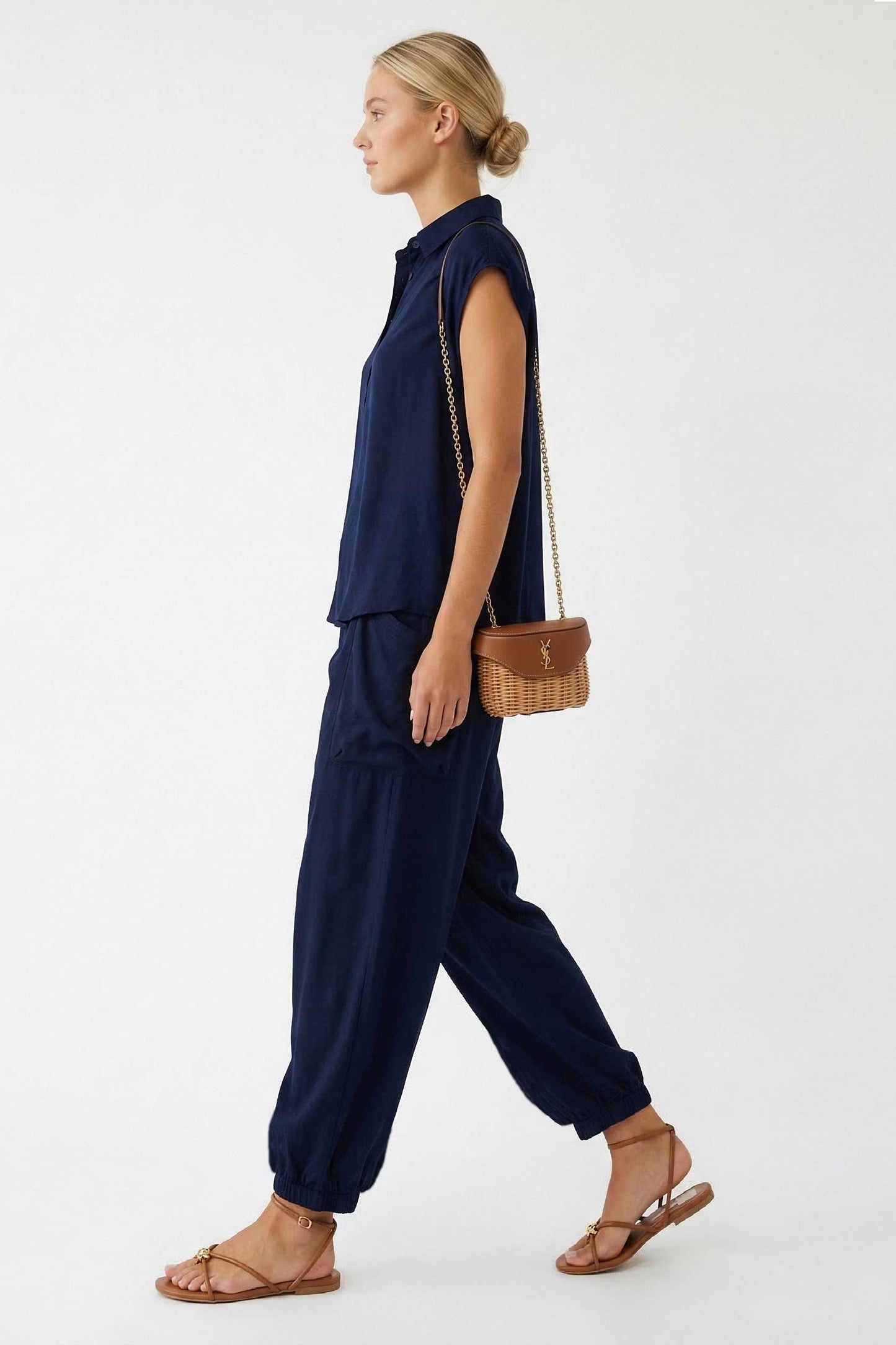Side view of navy harem pants with gathered ankle cuff