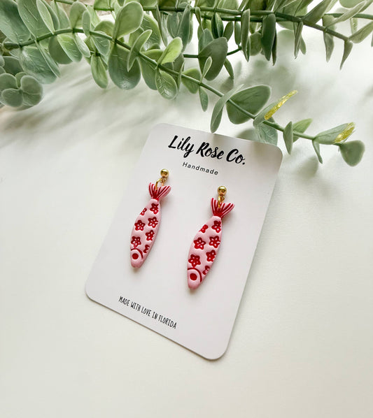 Pink and red floral fish earrings on handmade display card