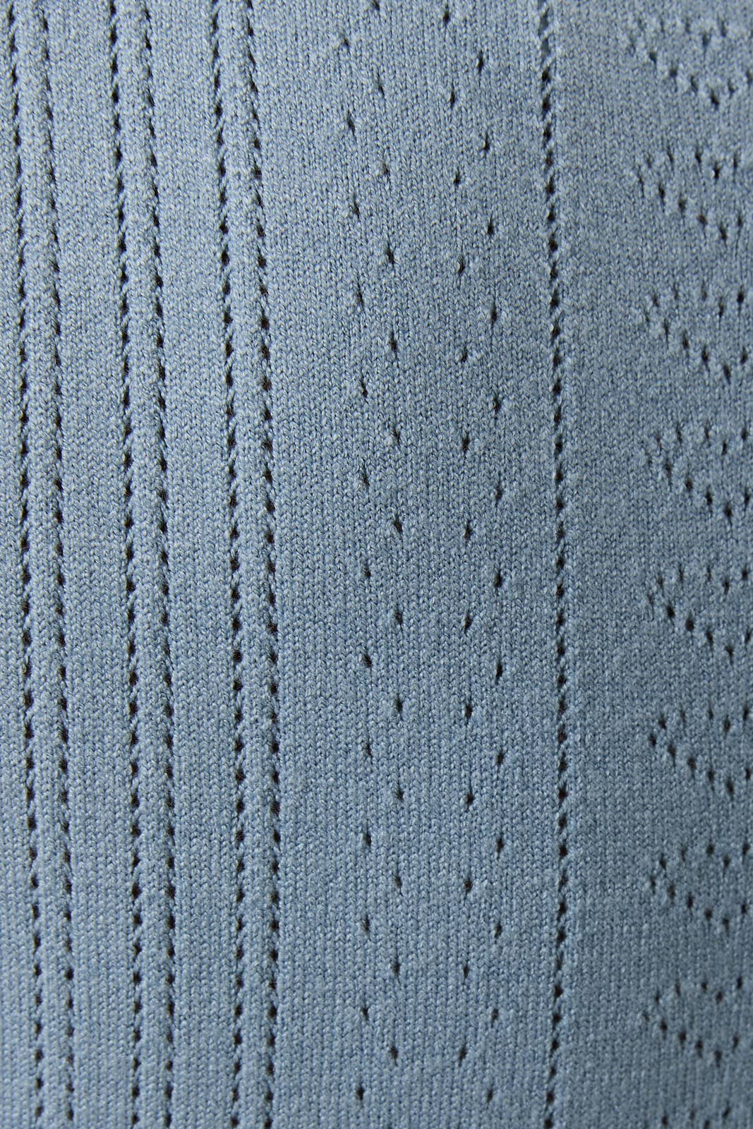 Close-up of a textured blue fabric with patterns
