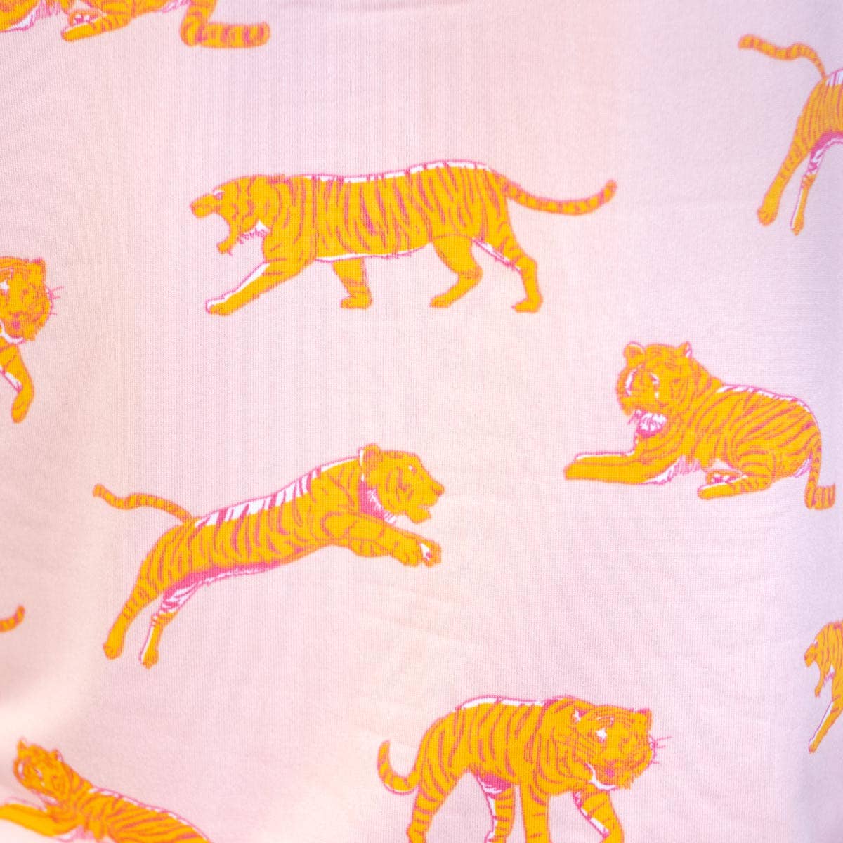 Pattern of orange tigers on a pink background