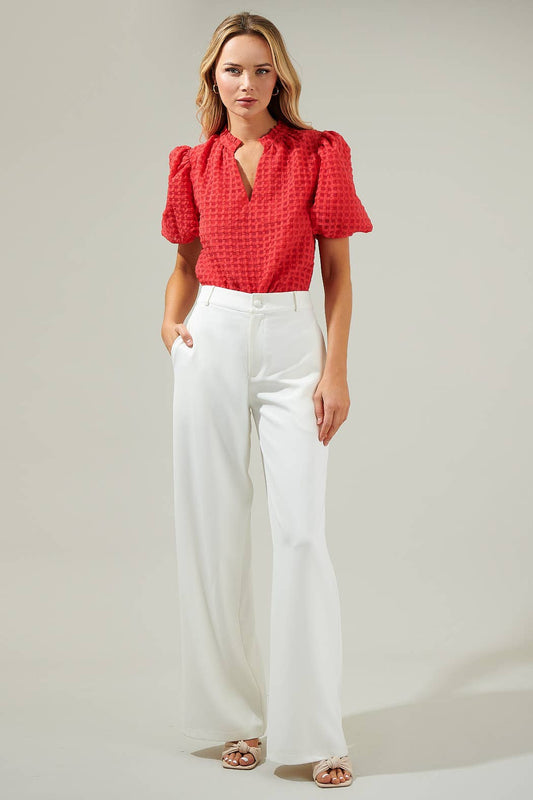 Red check organza blouse styled with white wide-leg pants