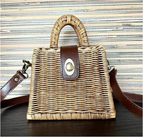 Petite natural rattan handbag with top handle and brown strap