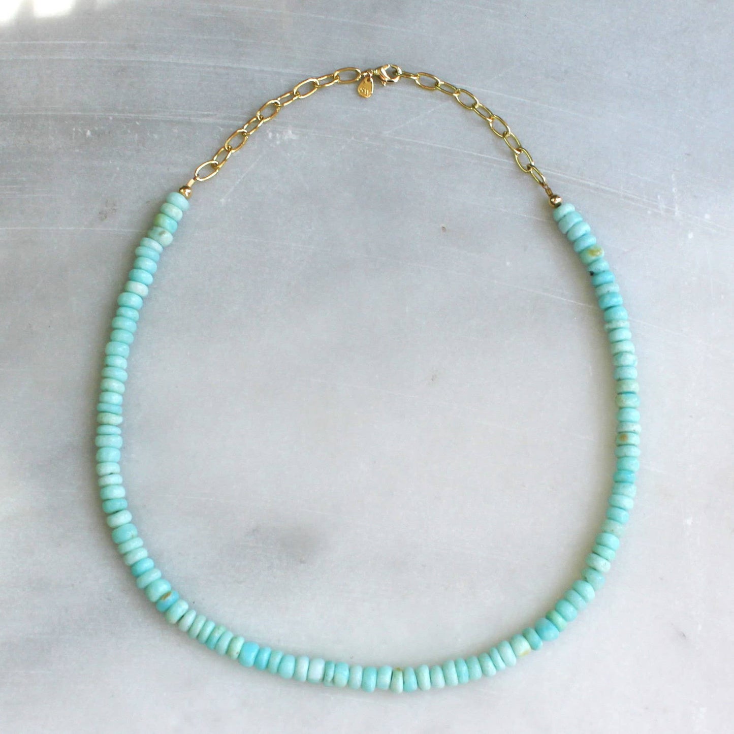 Aqua beaded necklace with gold chain extender and clasp