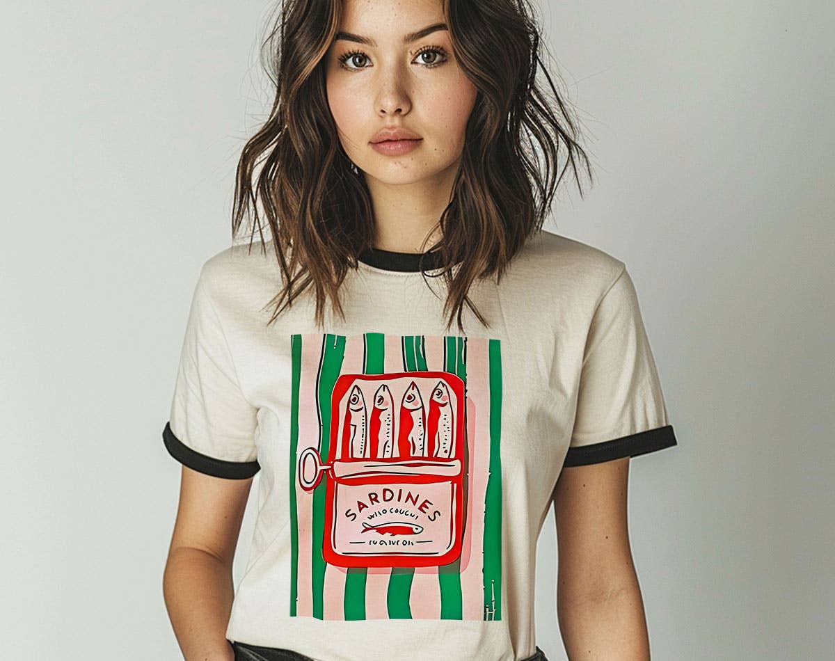 Person wearing a t-shirt with a sardine can graphic design on a plain background