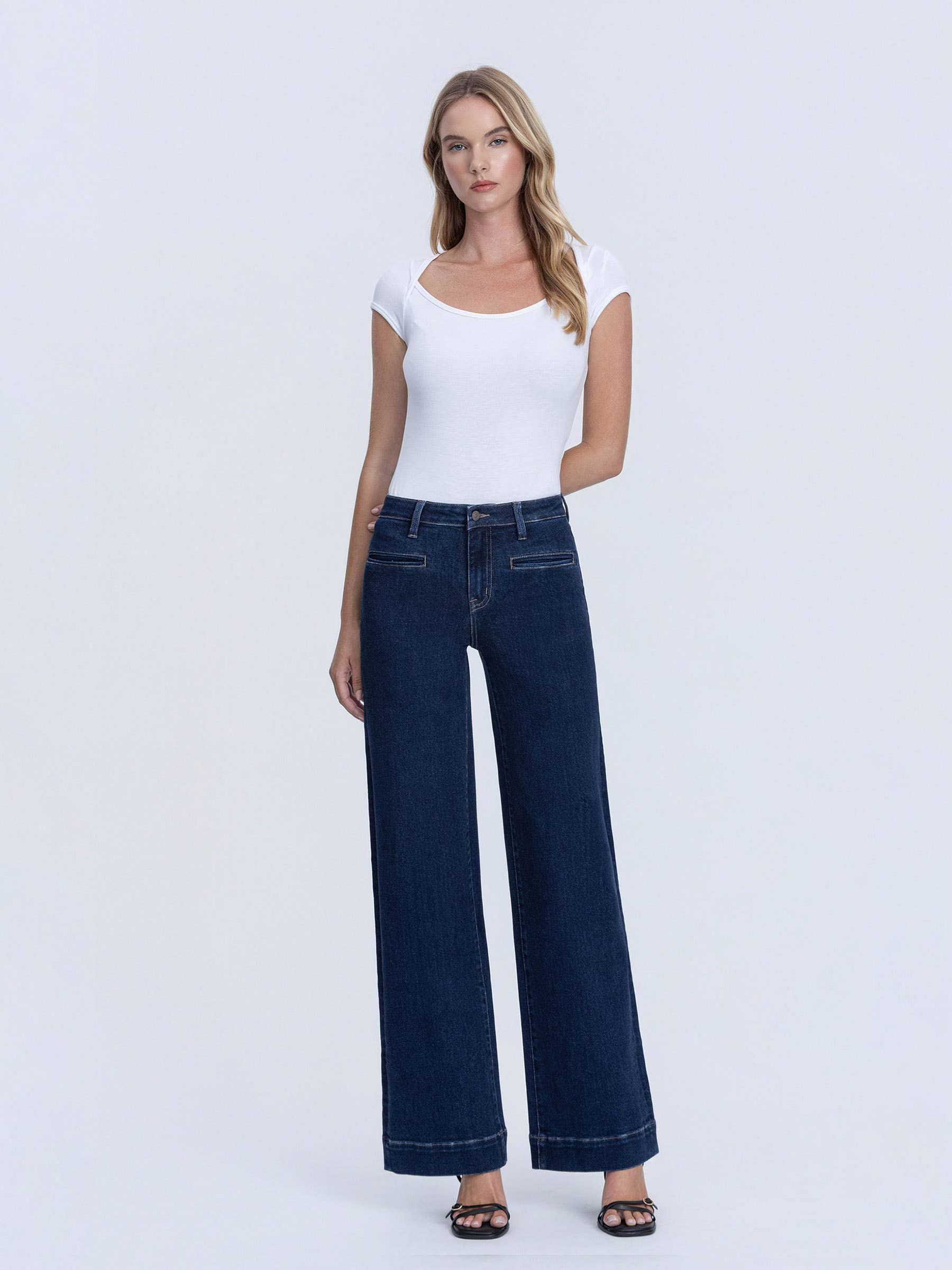 Front waist and leg view of dark wash trouser jeans
