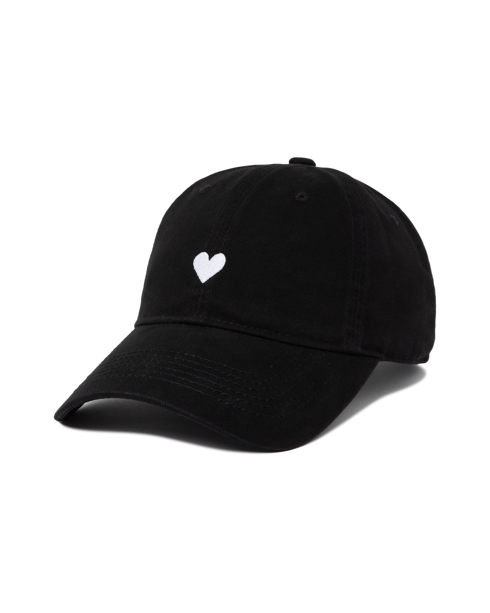Close-up of black dad hat with white heart embroidery
