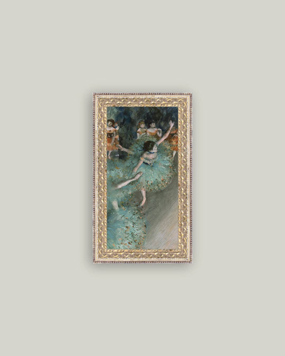 Framed art print of a ballerina in green on a pale wall