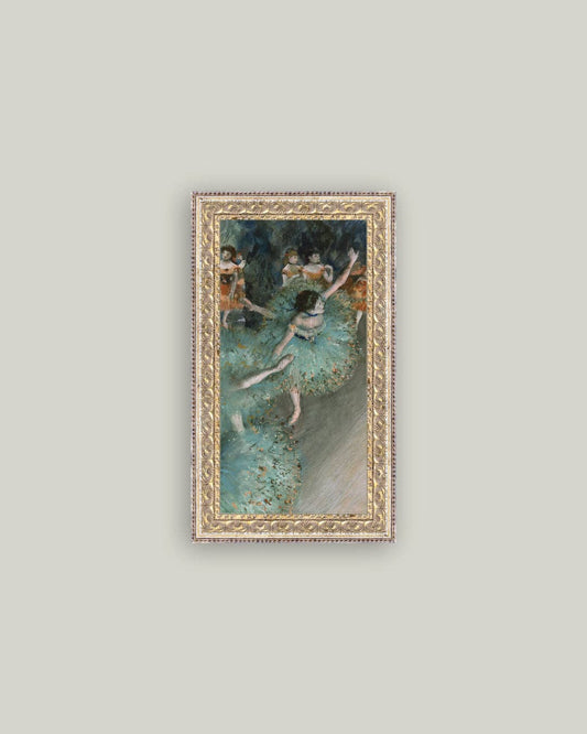 Framed art print of a ballerina in green on a pale wall