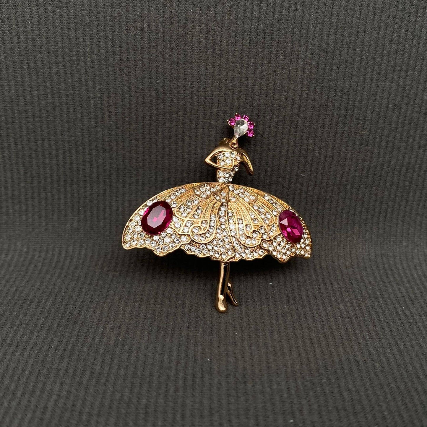 Gold ballet dancer rhinestone brooch with pink gem accents