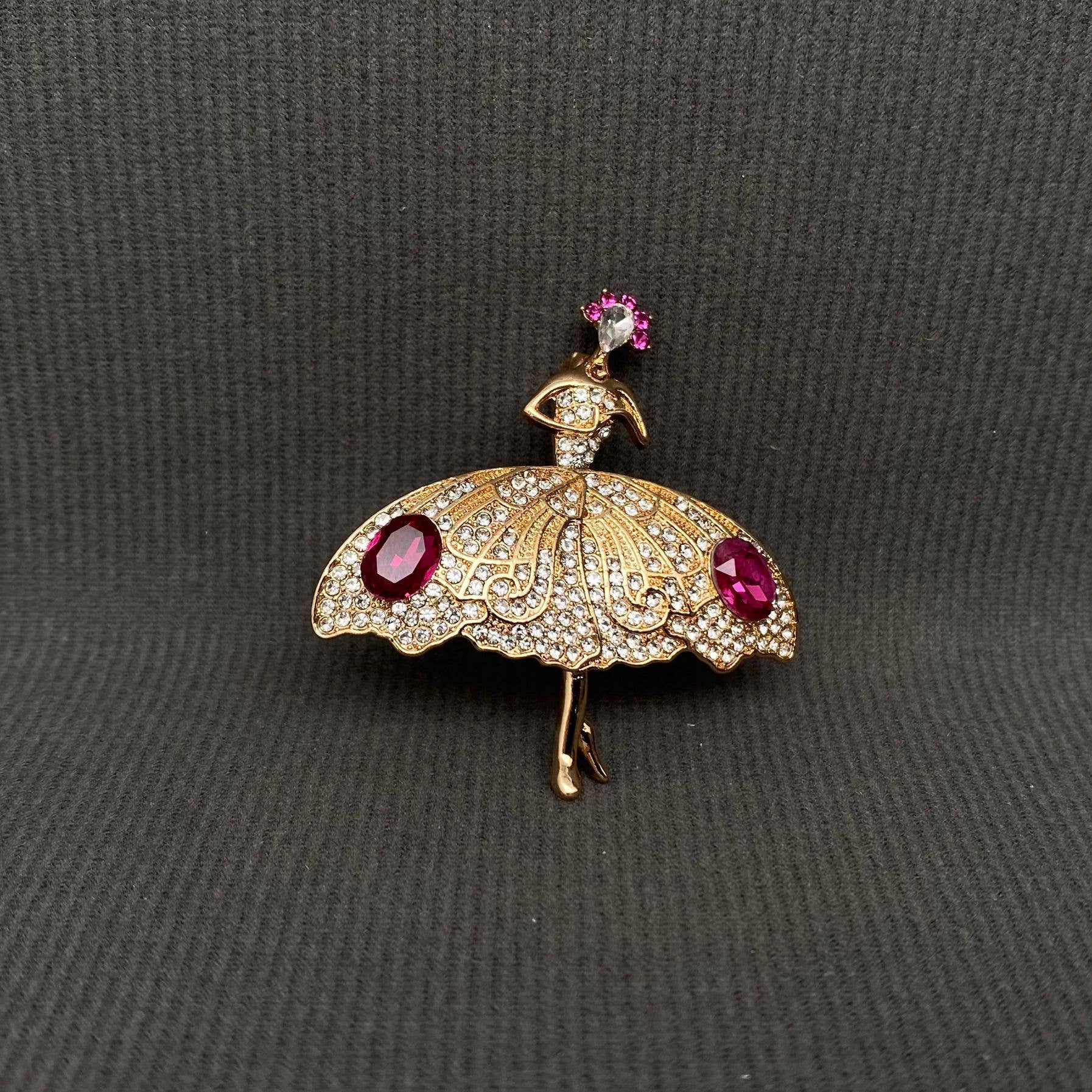 Gold ballet dancer rhinestone brooch with pink gem accents