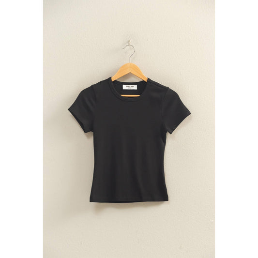 Black crew neck short sleeve top hanging on a wooden hanger
