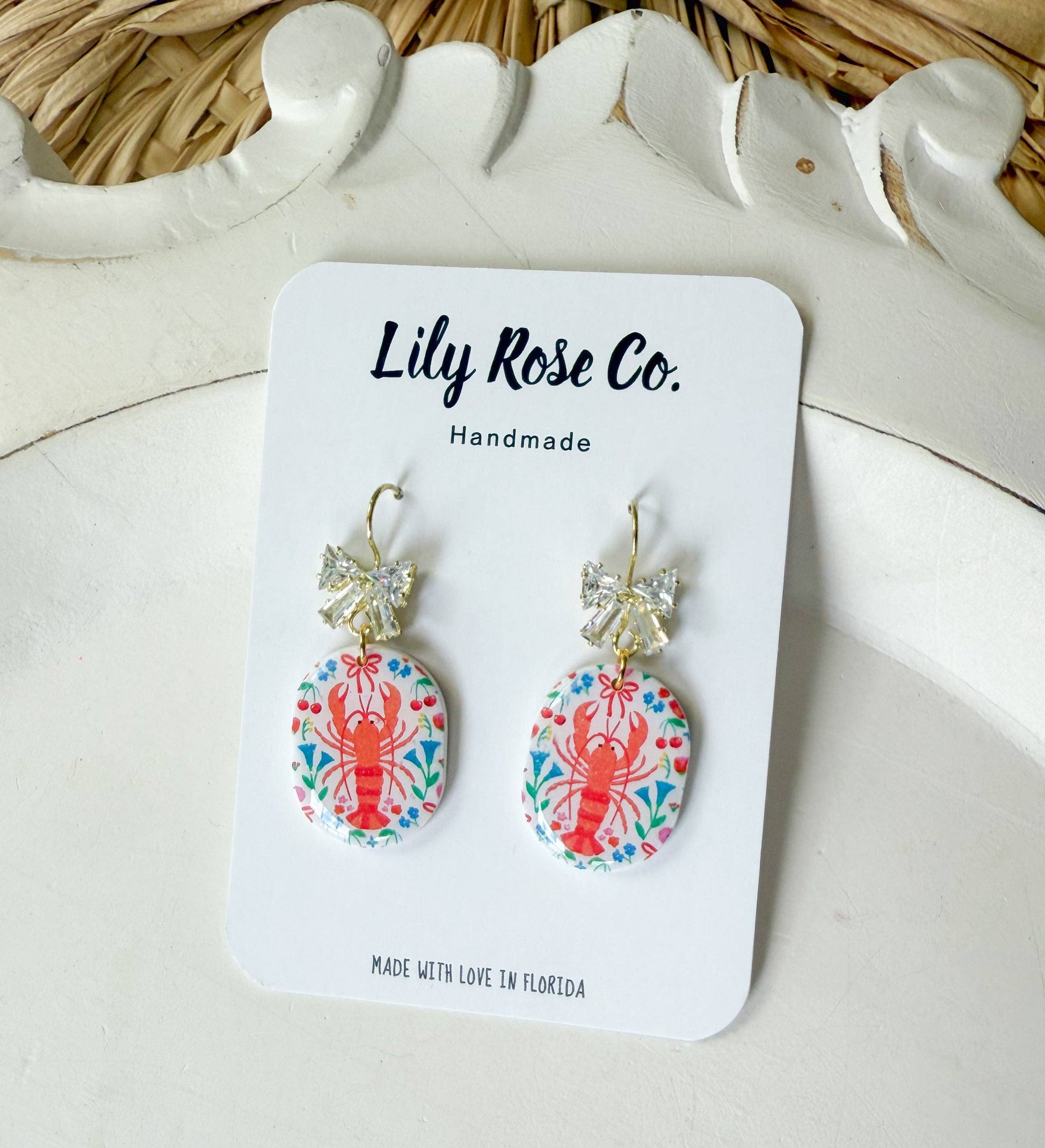 Lobster and floral print earrings on Lily Rose Co display card