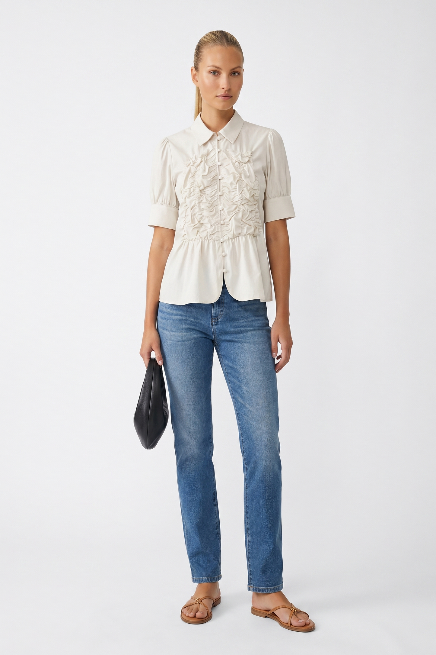 Off white ruched button-up blouse on a white studio background