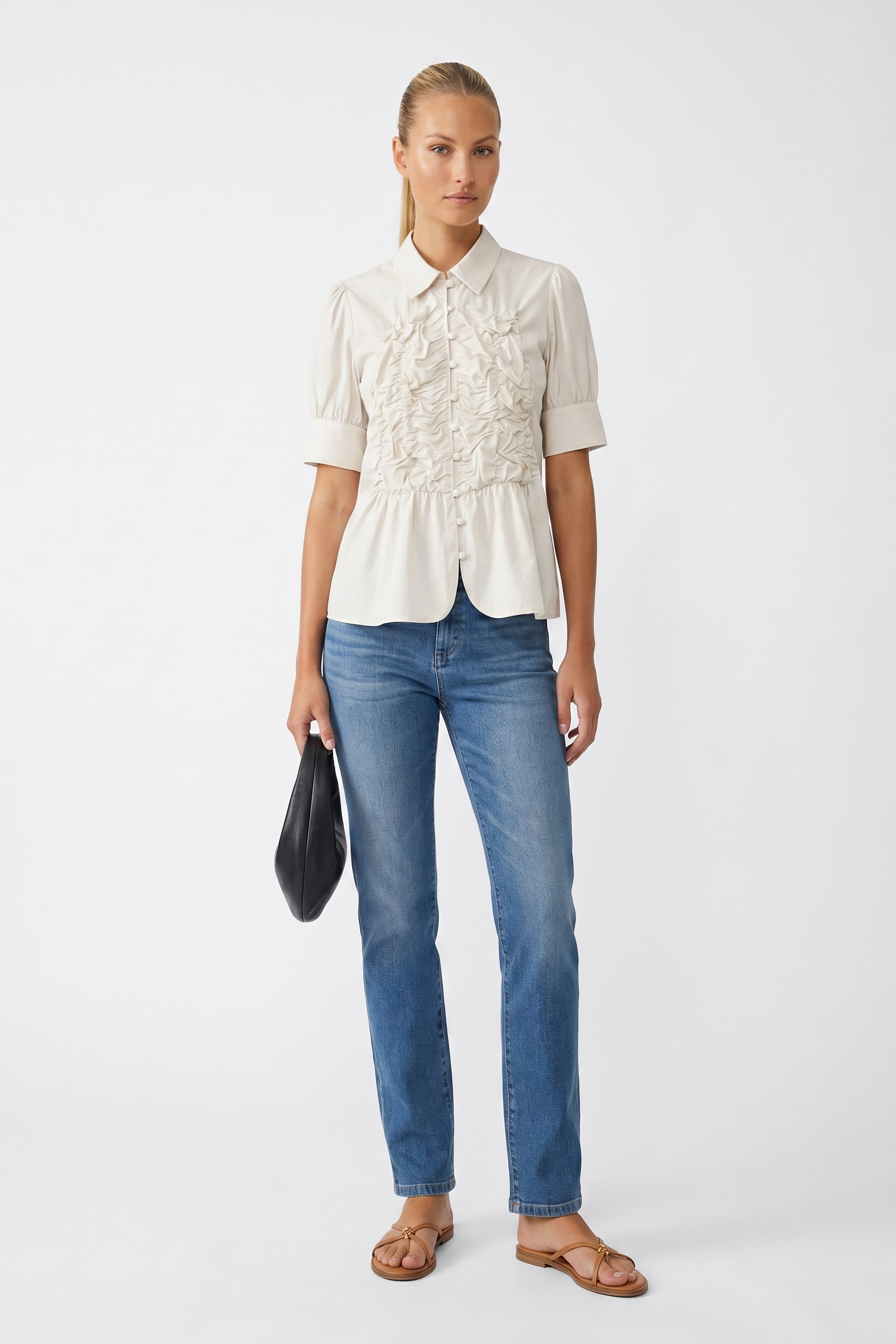 Off white ruched button-up blouse on a white studio background