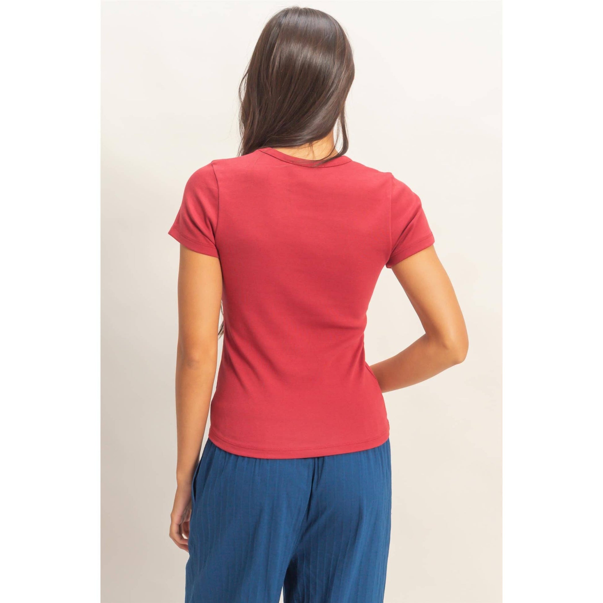 Back view of rose crew neck short sleeve top with short fitted sleeves