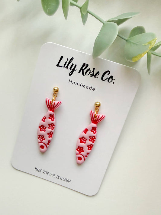Pink fish drop earrings with red floral pattern