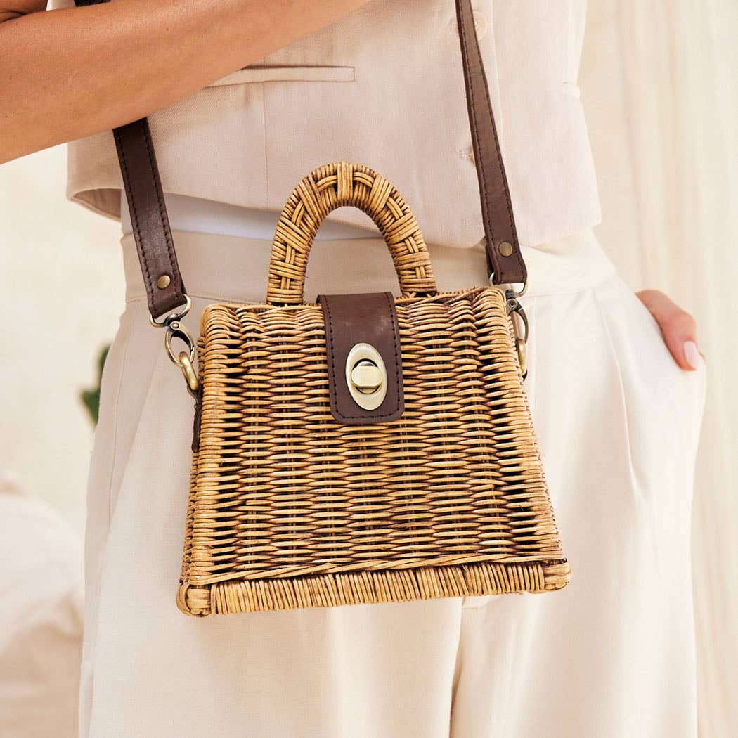 Petite rattan handbag with brown crossbody strap and turn-lock clasp