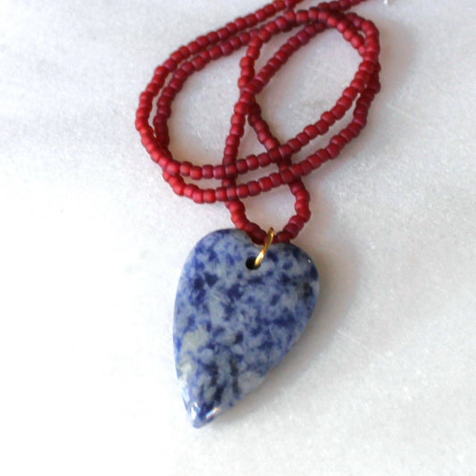 Blue speckled heart pendant necklace with rust red seed beads