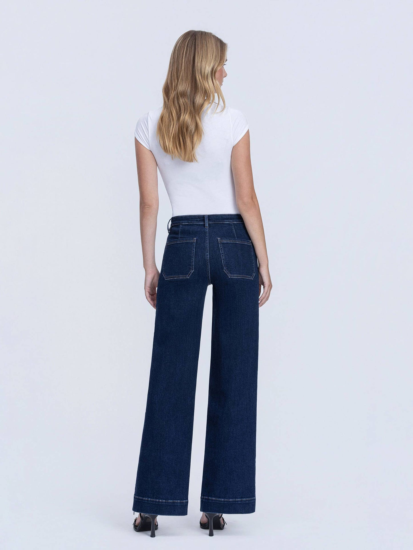 Back view of dark wash wide leg trouser jeans