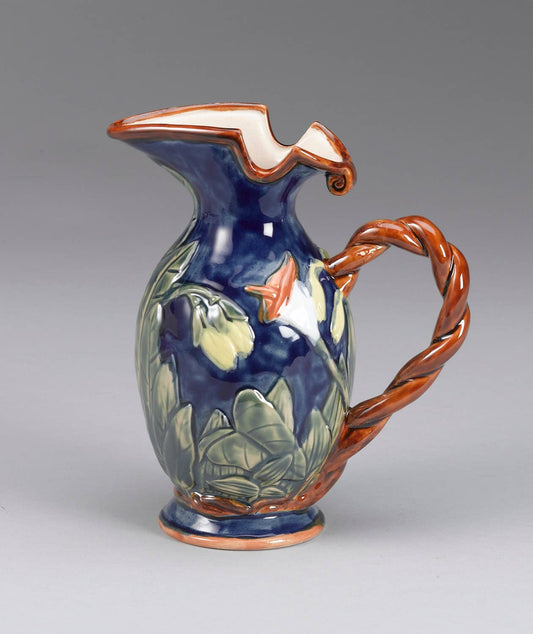 Blue floral pitcher with twisted brown handle